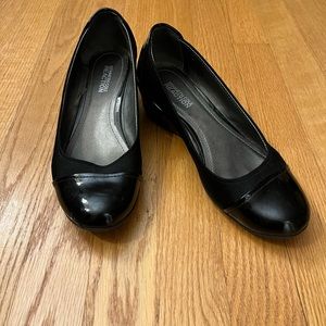 Gently used black wedge patent leather and fabric shoes.